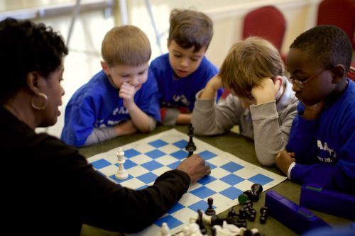 Children that are totally engaged in a Chess for Children Lesson