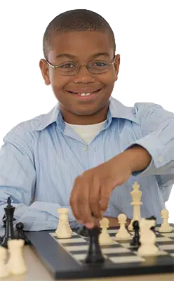 Smiling Boy playing chess